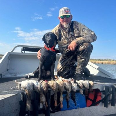 man and dog on a duck hunt with panther airboat